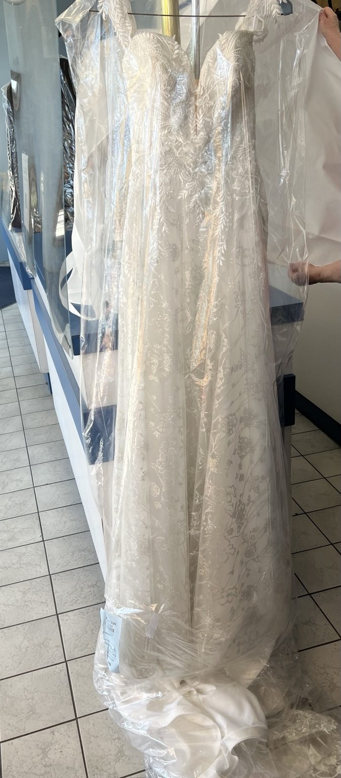 Multiple wedding gowns prepared after cleaning
